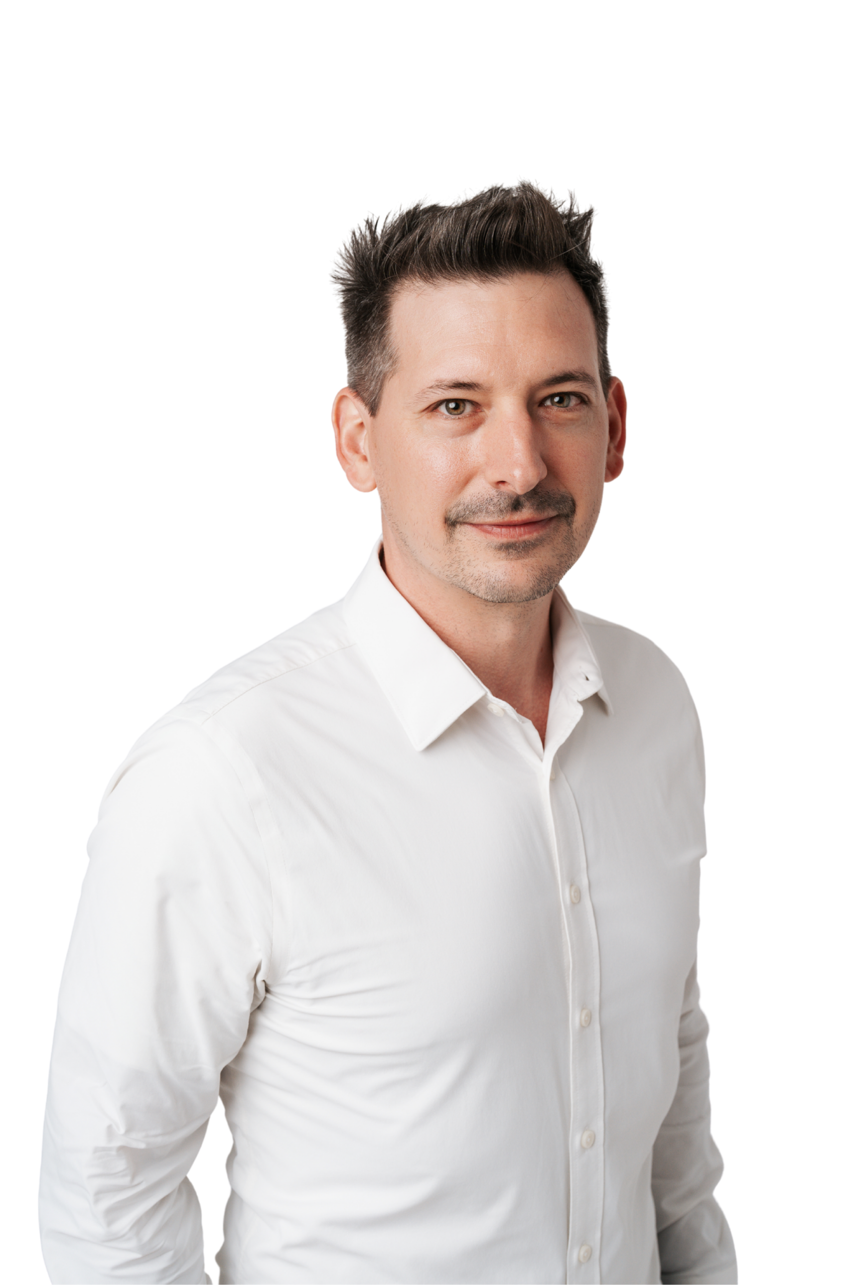 Jordon Taylor wearing a white button down smiling into the camera